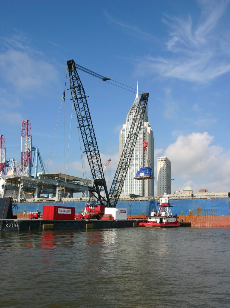 Heavy-Lift-Crane.First-Move.-6.10.10 Barge-mounted heavy lift crane, Heavy lift crane, Super post Panamax crane, Post Panamax crane, Mobile Container Terminal, APMT, McDuffie Coal Terminal, Metallurgical coal, Alabama Steel Terminal, Connectivity , Rail Access, On dock cold storage, Cold storage facilities, Real estate, Commercial development, Mobile River, Mobile Bay, Rail Ferry